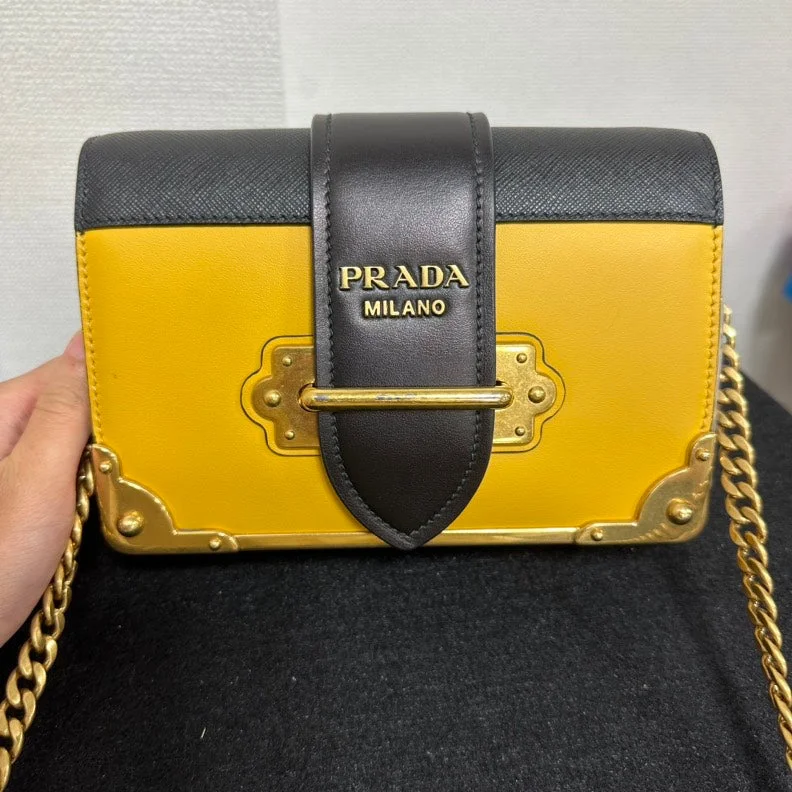 Ladies Prada handbags with a detachable wallet inside for added conveniencePrada Cahier Crossbody Bag,Yellow & Black,Leather