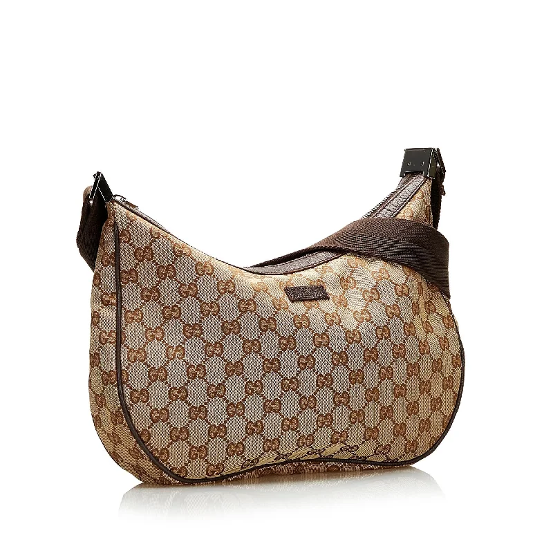 Women Gucci bags with a chain - link trim and a leather bodyGucci GG Canvas Crossbody (35449)