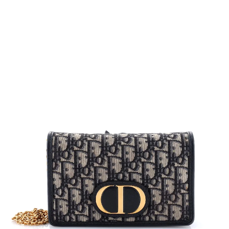 Prada Cleo bags with a crystal - embellished logo for added luxury30 Montaigne 2-in-1 Pouch Oblique Canvas