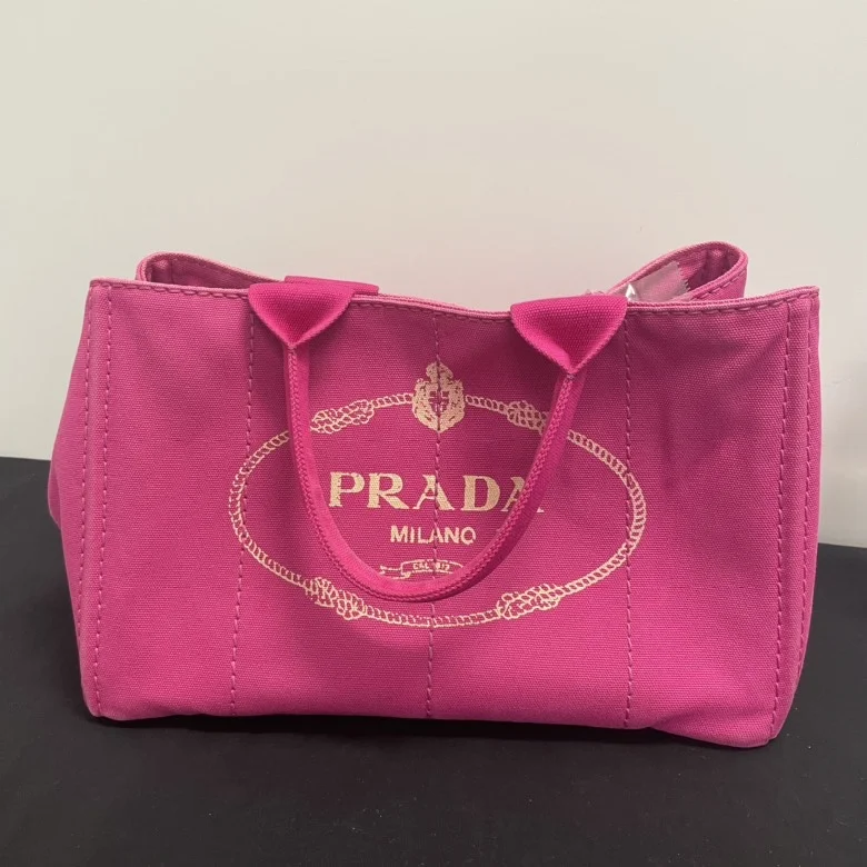 Prada Cleo bags with a detachable coin purse for added functionalityPrada Canapa Rose Red Canvas Tote Bag