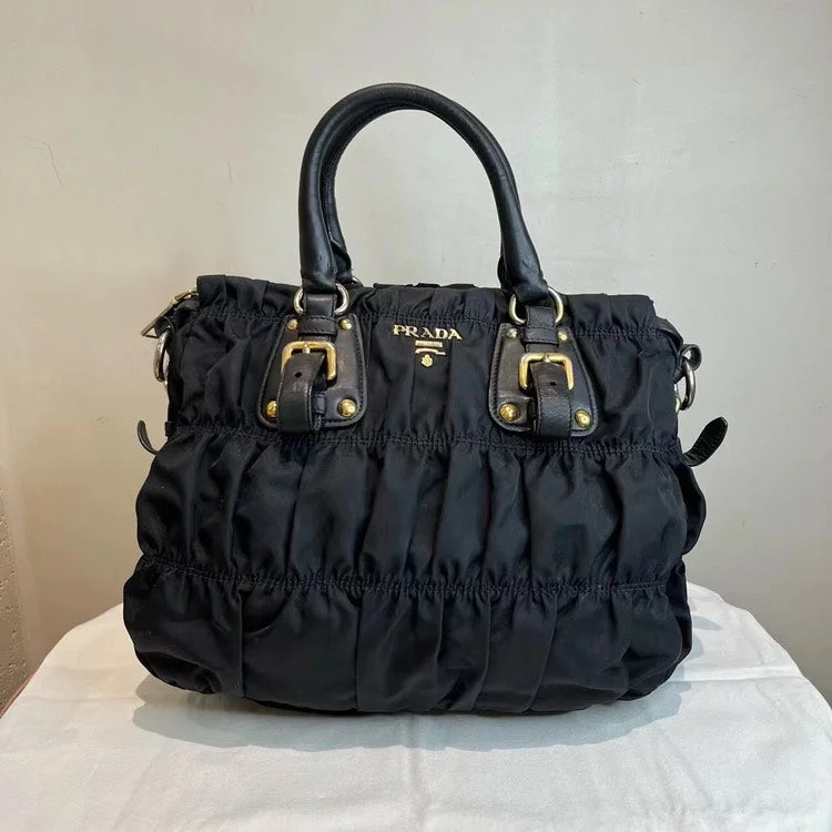 Prada Cleo bags with a contrast - colored interior for visual interestPrada Tessuto Nylon Gaufre Tote Nero Black